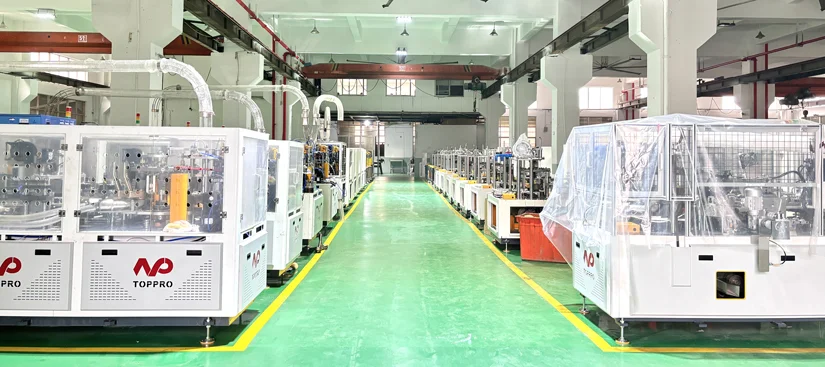 TOPPRO brand logo and a clean, modern cup forming machine in a bright factory – professional setting